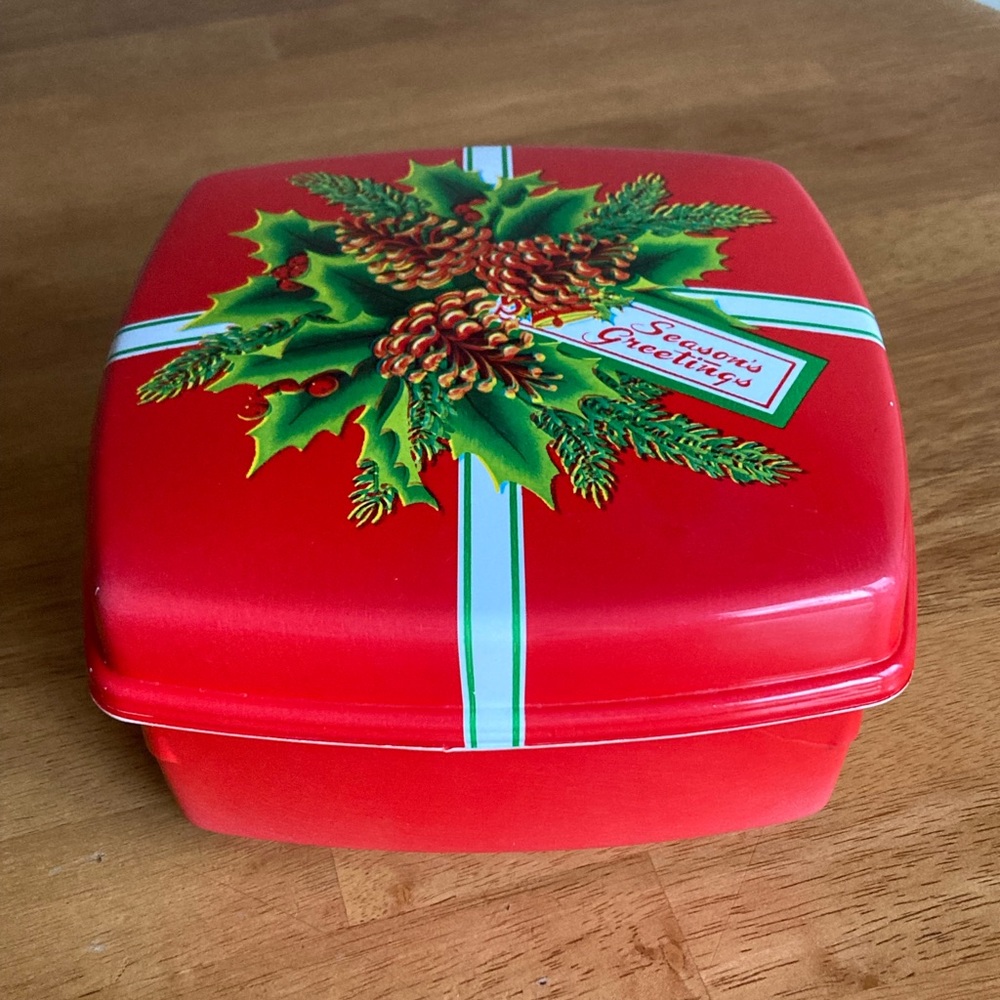Vintage Christmas candy/cookie container with holly and pine cones